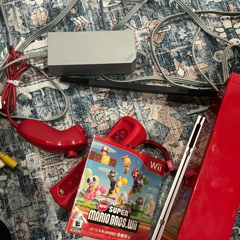 Nintendo Wii in Vibrant Red with Accessories controller. Some times. Works.